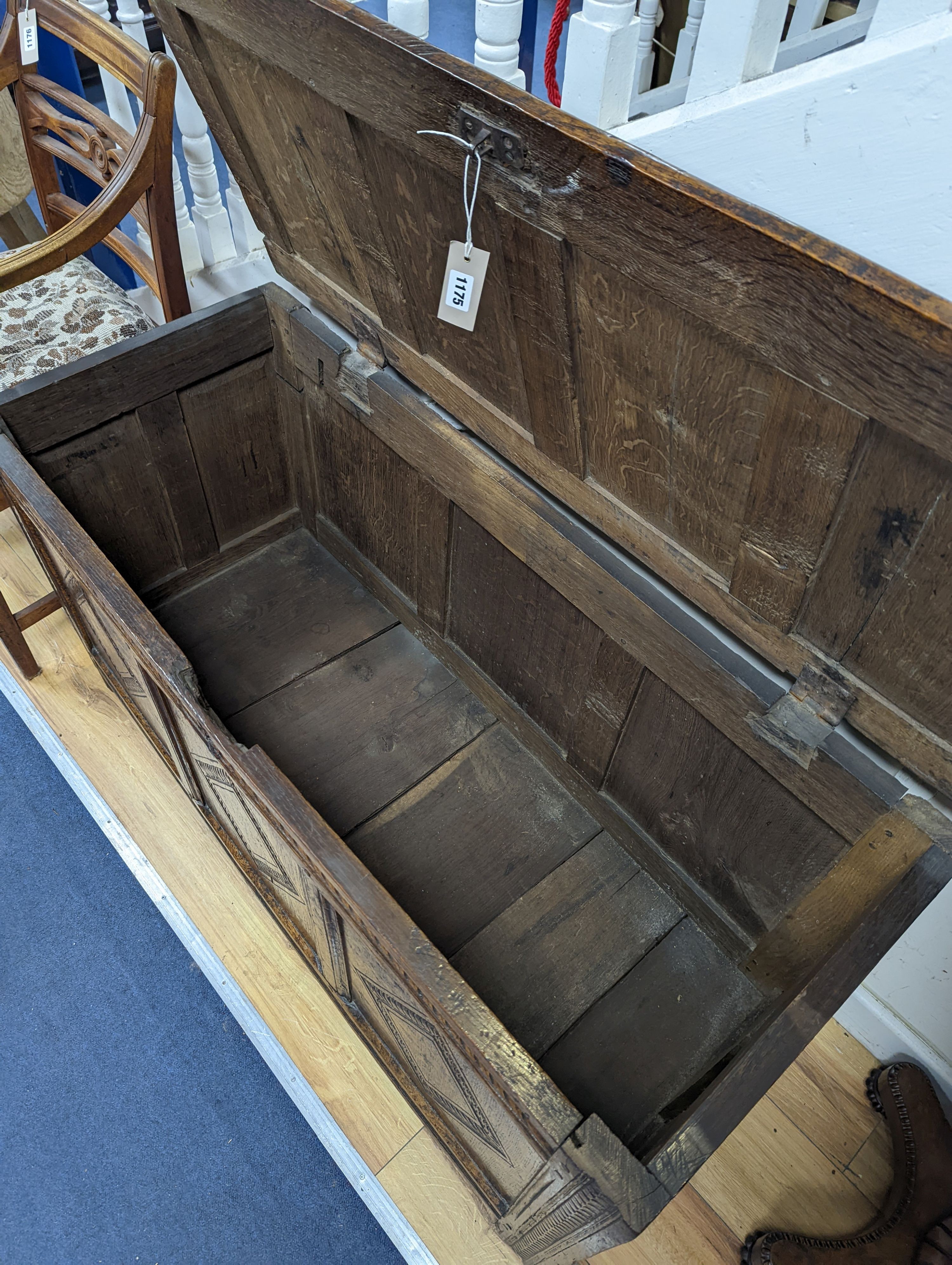 A 17th/18th century panelled oak coffer, length 122cm, depth 50cm, height 62cm